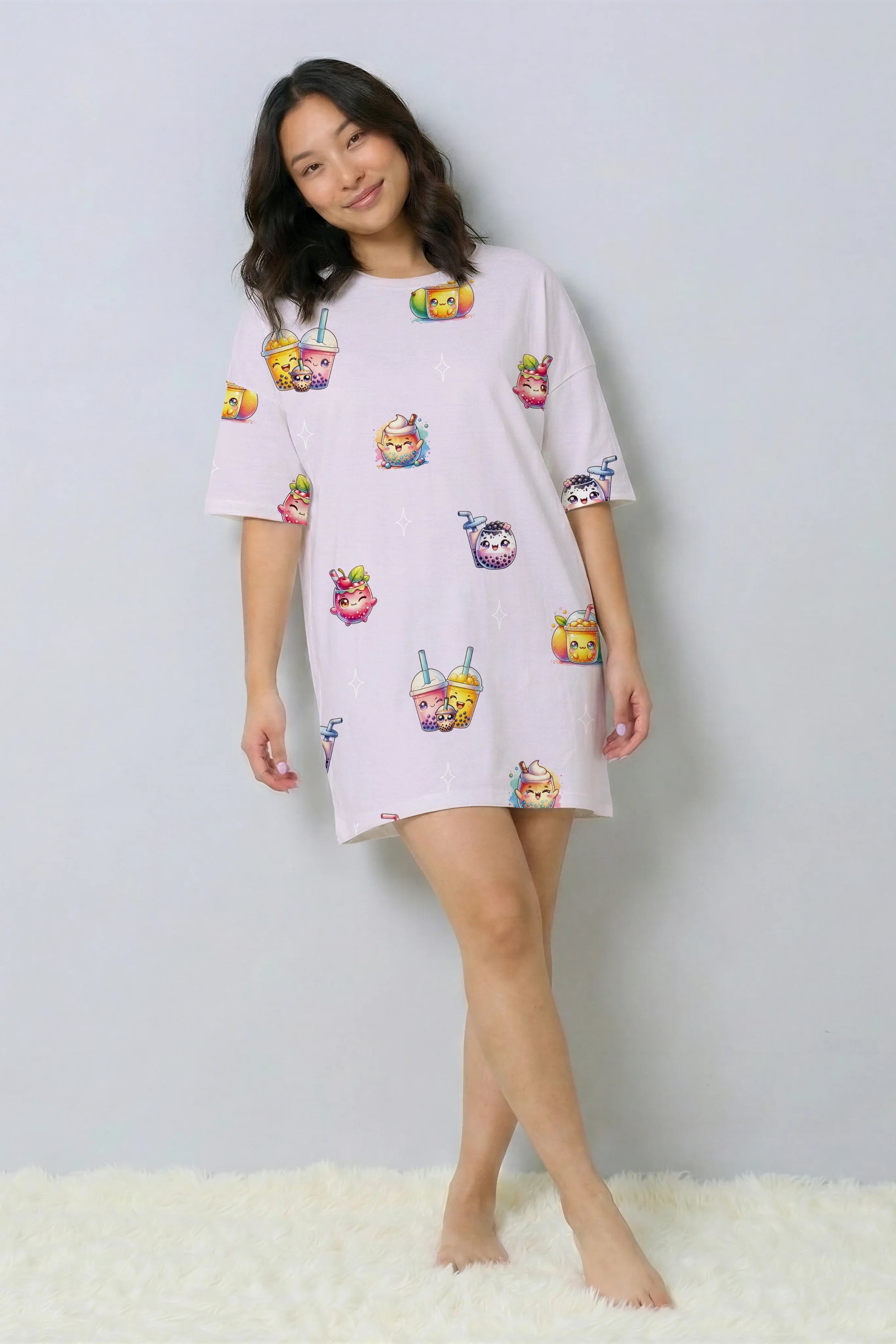 Model standing casually in a Bubble Tea print nightshirt. This oversized bamboo sleep tee features cute boba tea characters, offering cooling comfort for tropical sleepwear.
